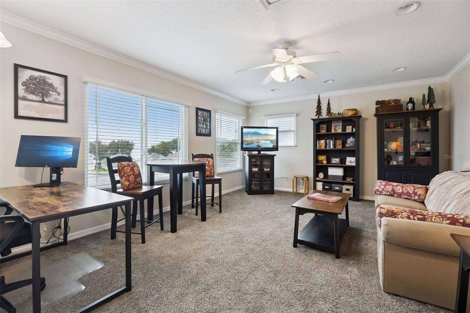 3210 SARATOGA DRIVE, Tavares, FL 32778 Beyond the two bedrooms, this bonus room offers flexible space for a home office, visiting guests, or your favorite hobbies