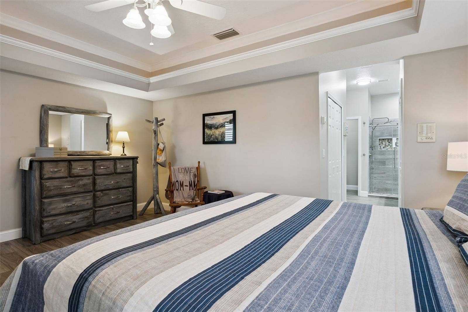 3210 SARATOGA DRIVE, Tavares, FL 32778 The primary suite flows directly into an updated ensuite bath