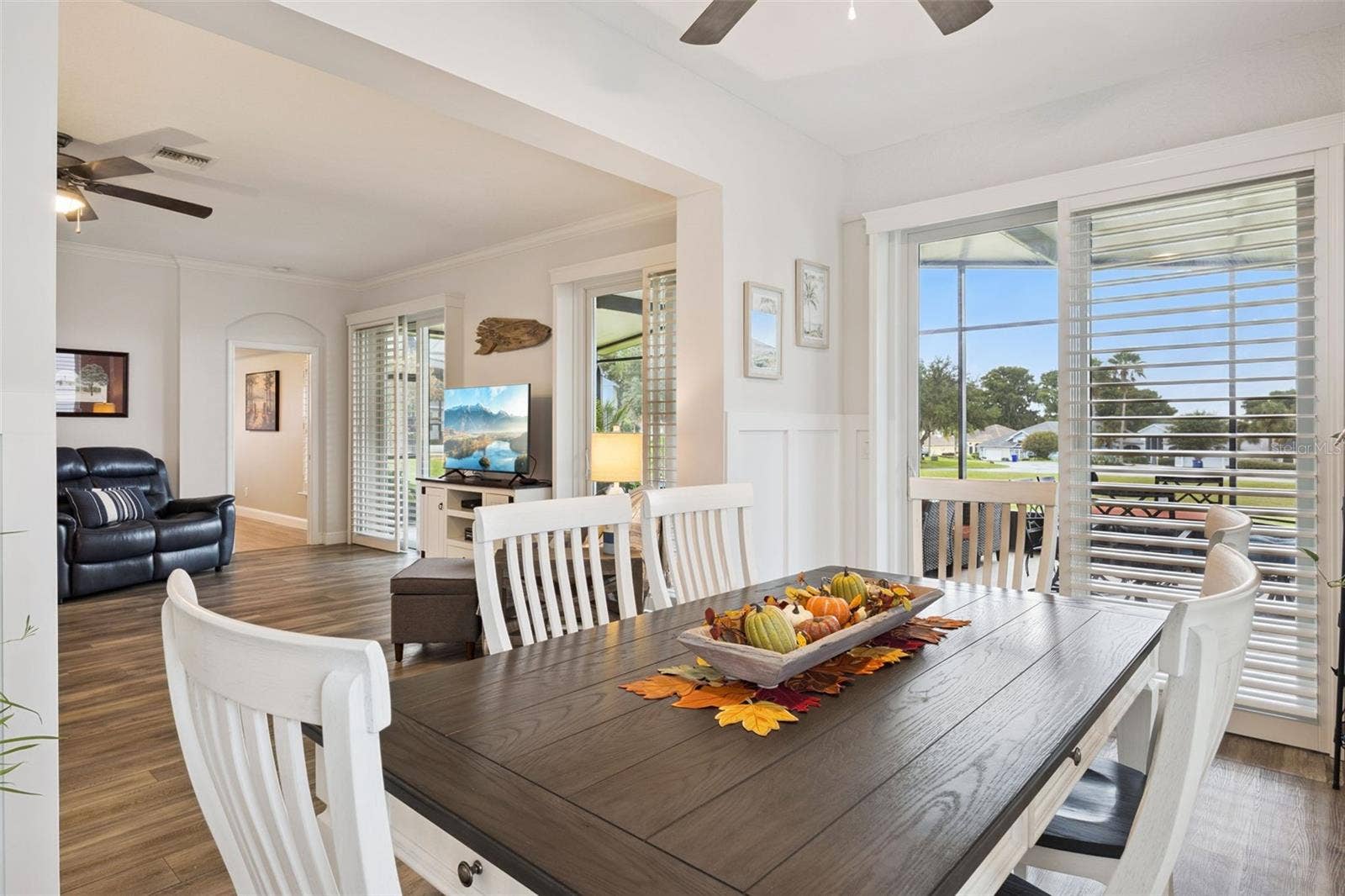 3210 SARATOGA DRIVE, Tavares, FL 32778 A $10K porch conversion added interior living space and created an inviting dining area for gathering with family and friends