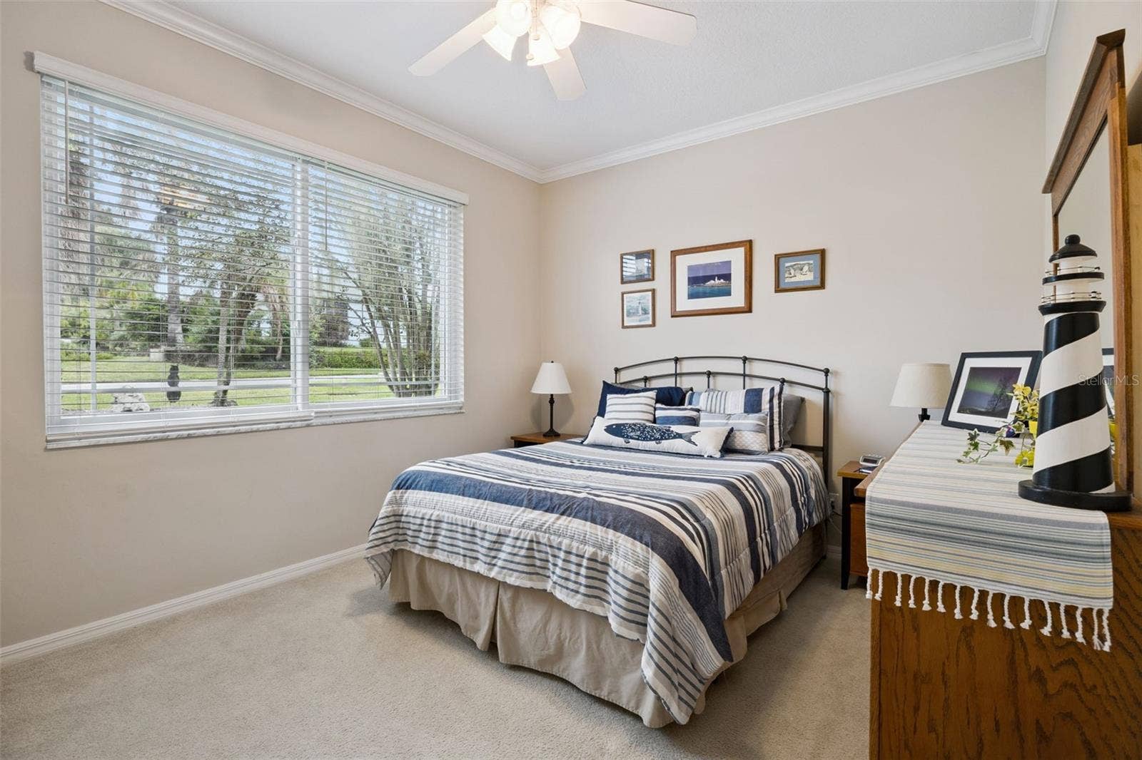 3210 SARATOGA DRIVE, Tavares, FL 32778 A welcoming second bedroom gives visiting friends and family a comfortable place to feel at home