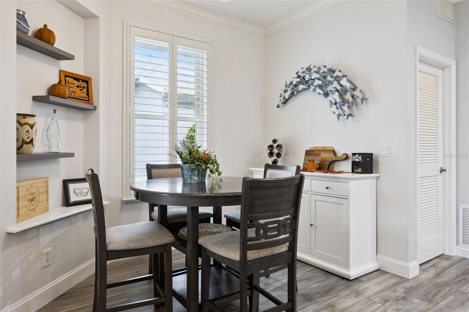 3210 SARATOGA DRIVE, Tavares, FL 32778 Upgraded baseboards add a polished finish, while built-ins bring character and decorative flair to the space