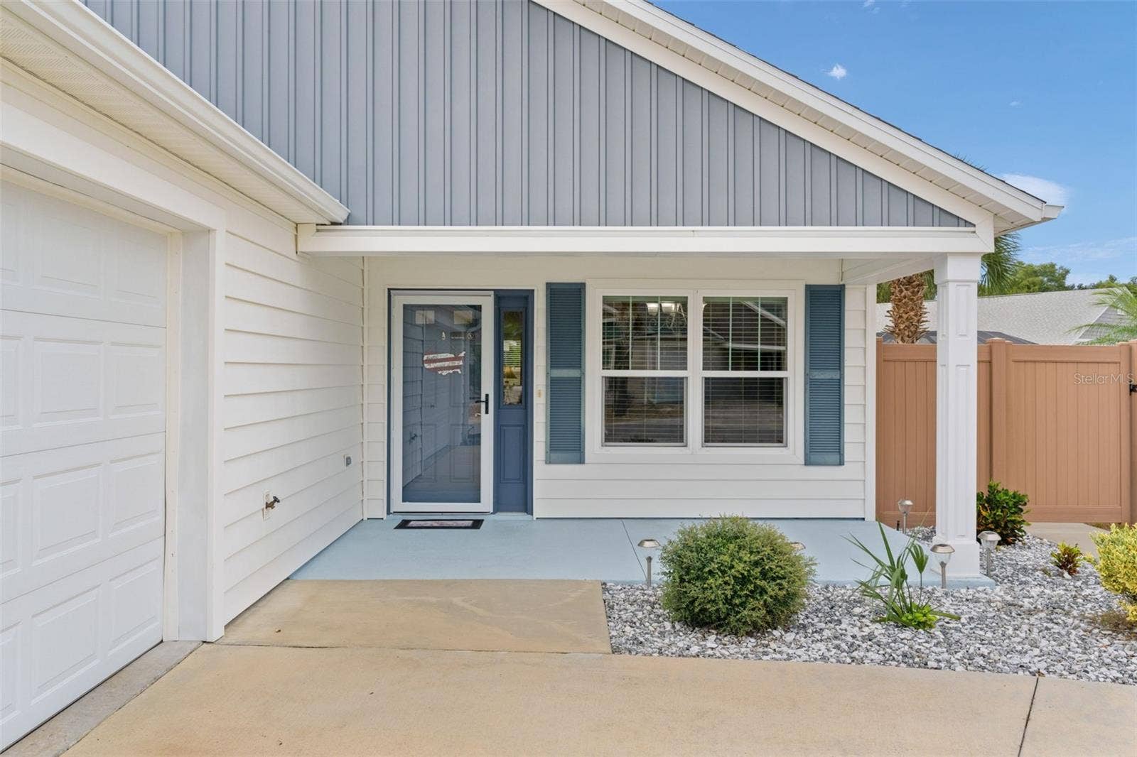The front glass storm door welcomes you into a bright & sunny, open floor plan.