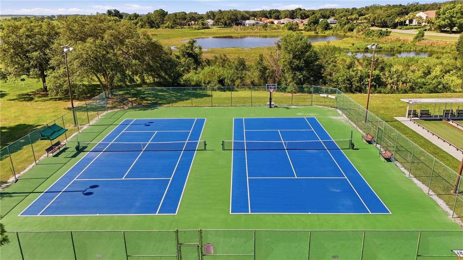 21736 PRINCESS GRACE COURT, Leesburg, FL 34748 There are four (4) TENNIS COURTS.