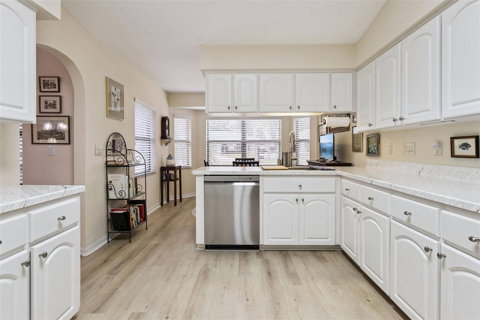 21736 PRINCESS GRACE COURT, Leesburg, FL 34748 The KITCHEN has AMPLE COUNTER SPACE & CABINETS