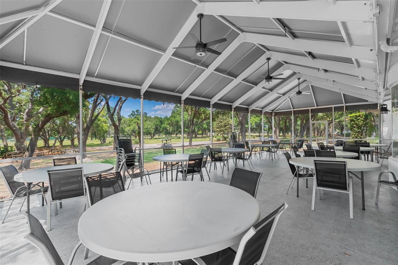 Community amenity: screened pavilion with tables and ceiling fans