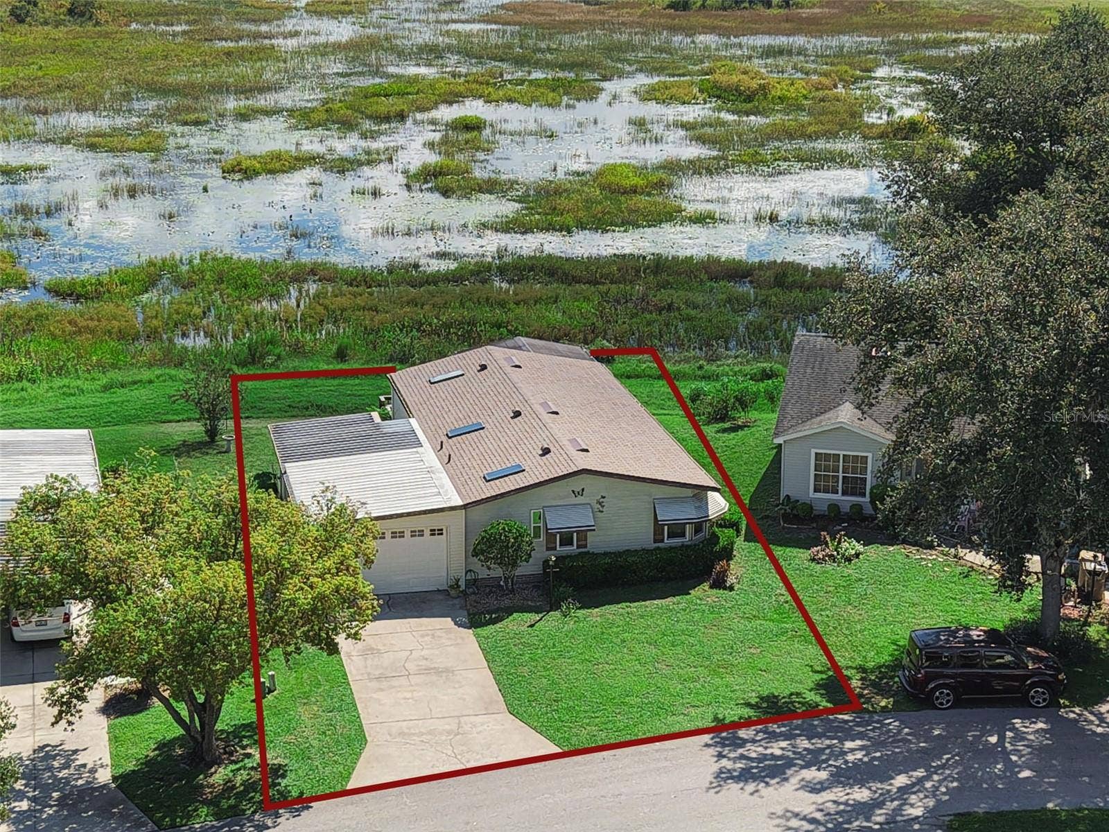 Aerial view with an approximate lot outline drawn in. Not a survey.