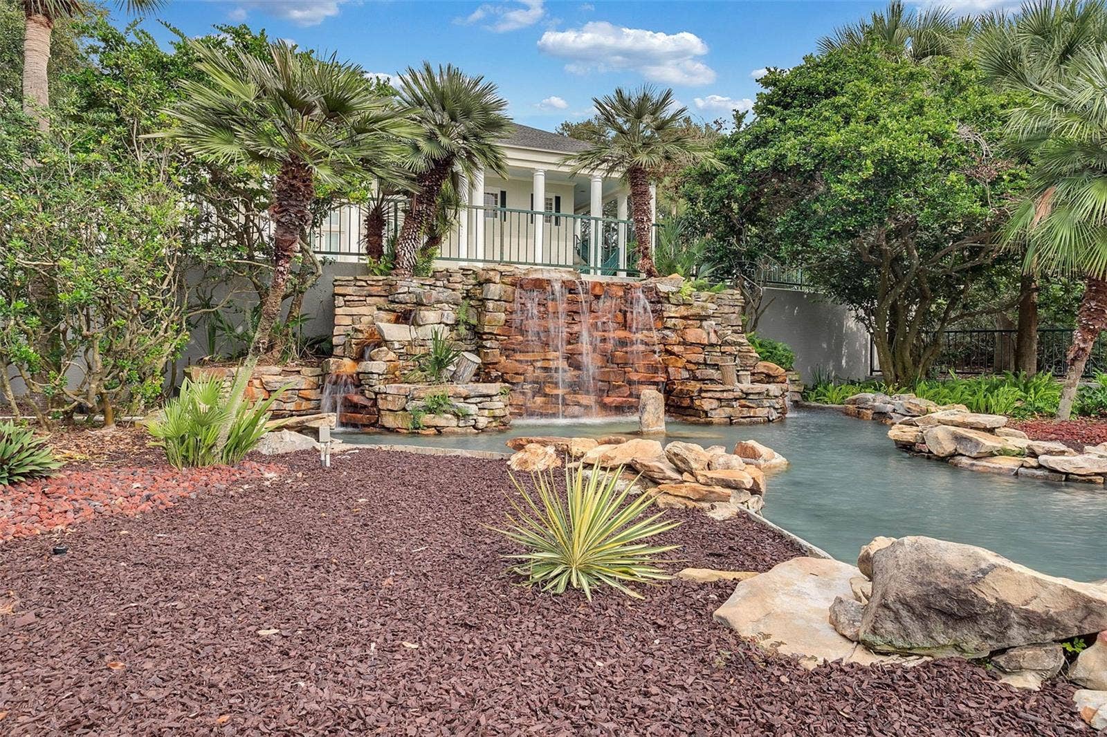 Community amenity: rock waterfall feature at the pool