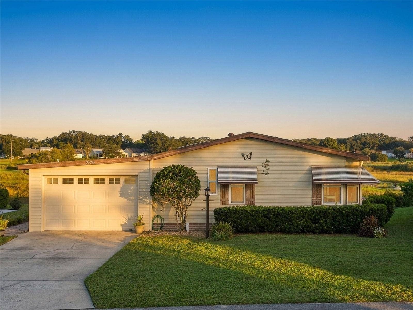 Digitally enhanced golden-hour light: elevated front view with the open marsh behind