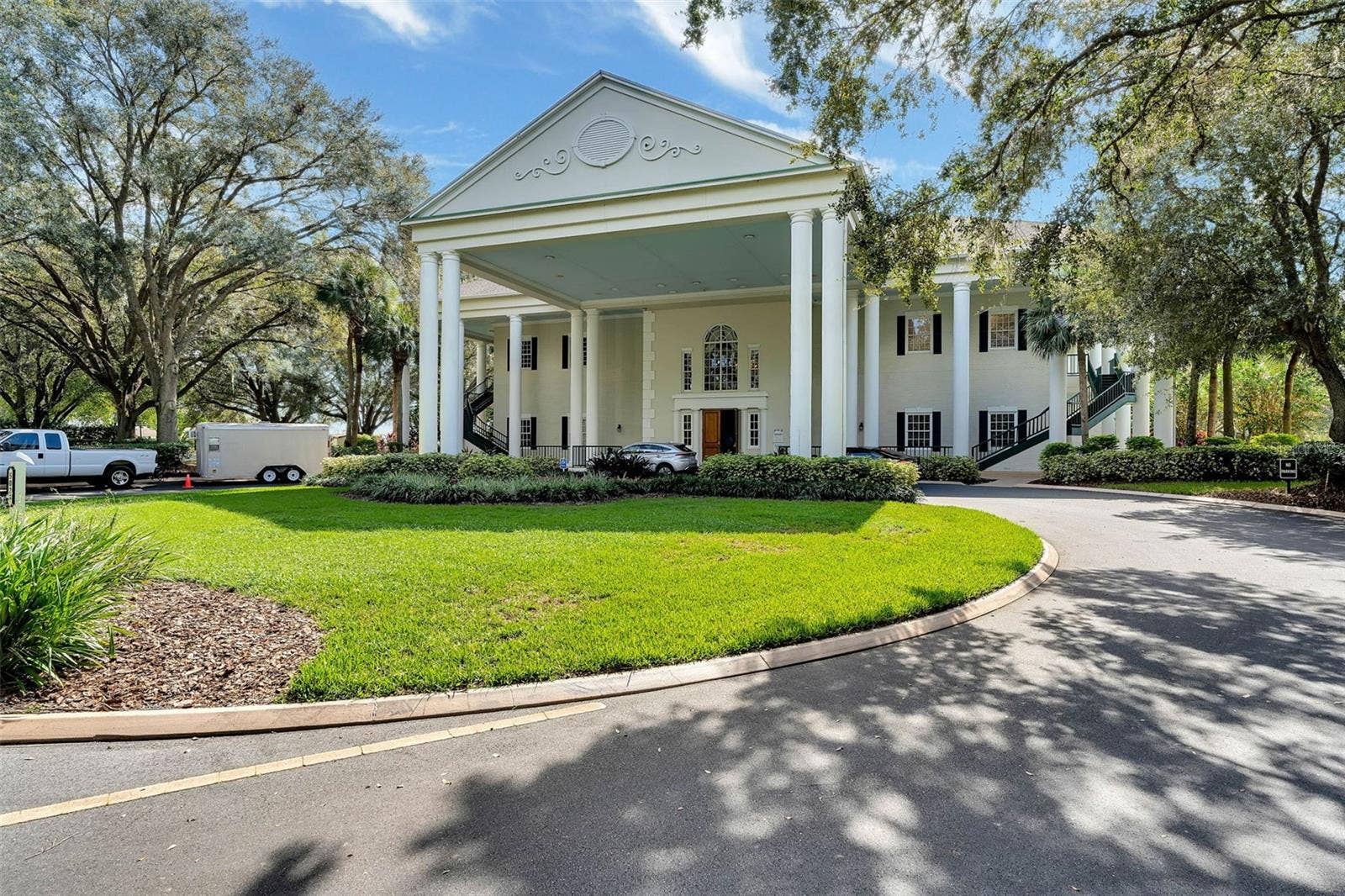 Community amenity: clubhouse exterior with a columned portico