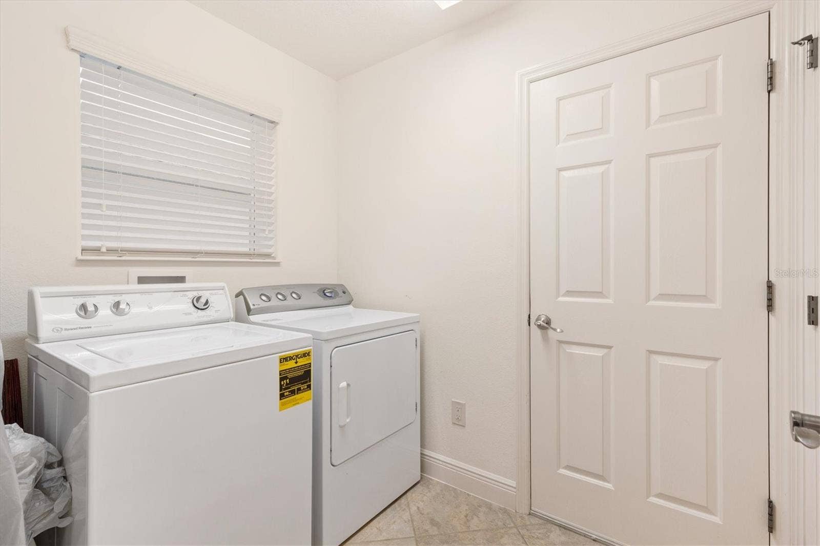 1926 ELDRIDGE LOOP, The Villages, FL 32162 Inside laundry room with storage closet.