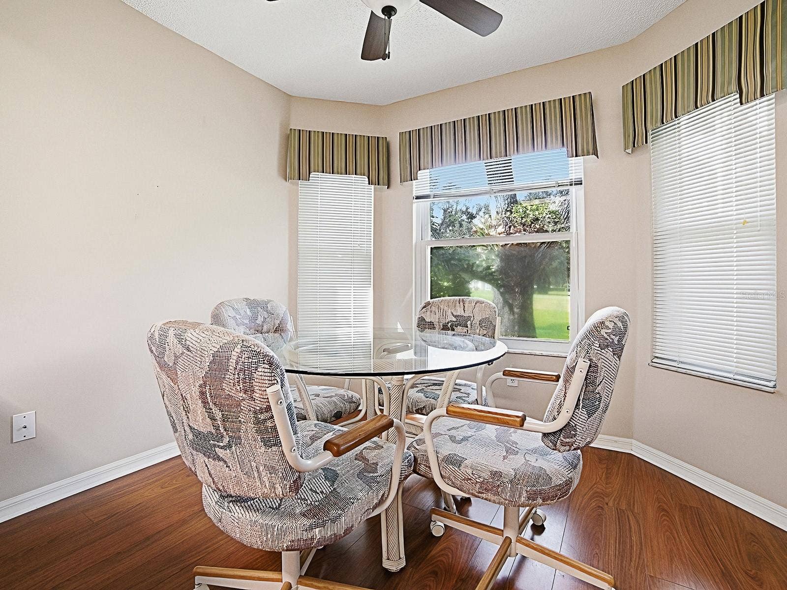 NATURAL LIGHT SHINES THROUGH YOUR EAT IN DINING AREA