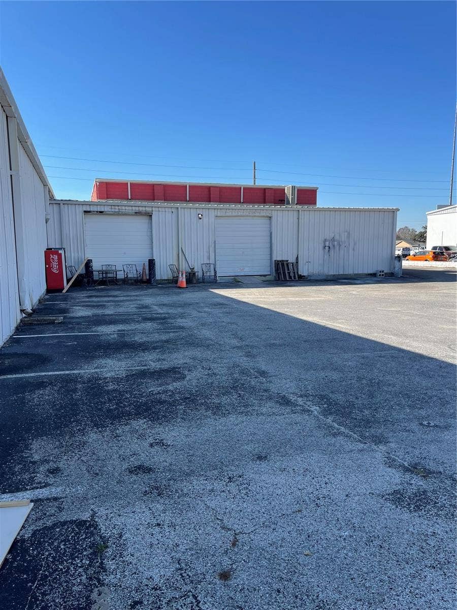 349 PLAZA DRIVE, Eustis, FL 32726 Side of the building and rear lot