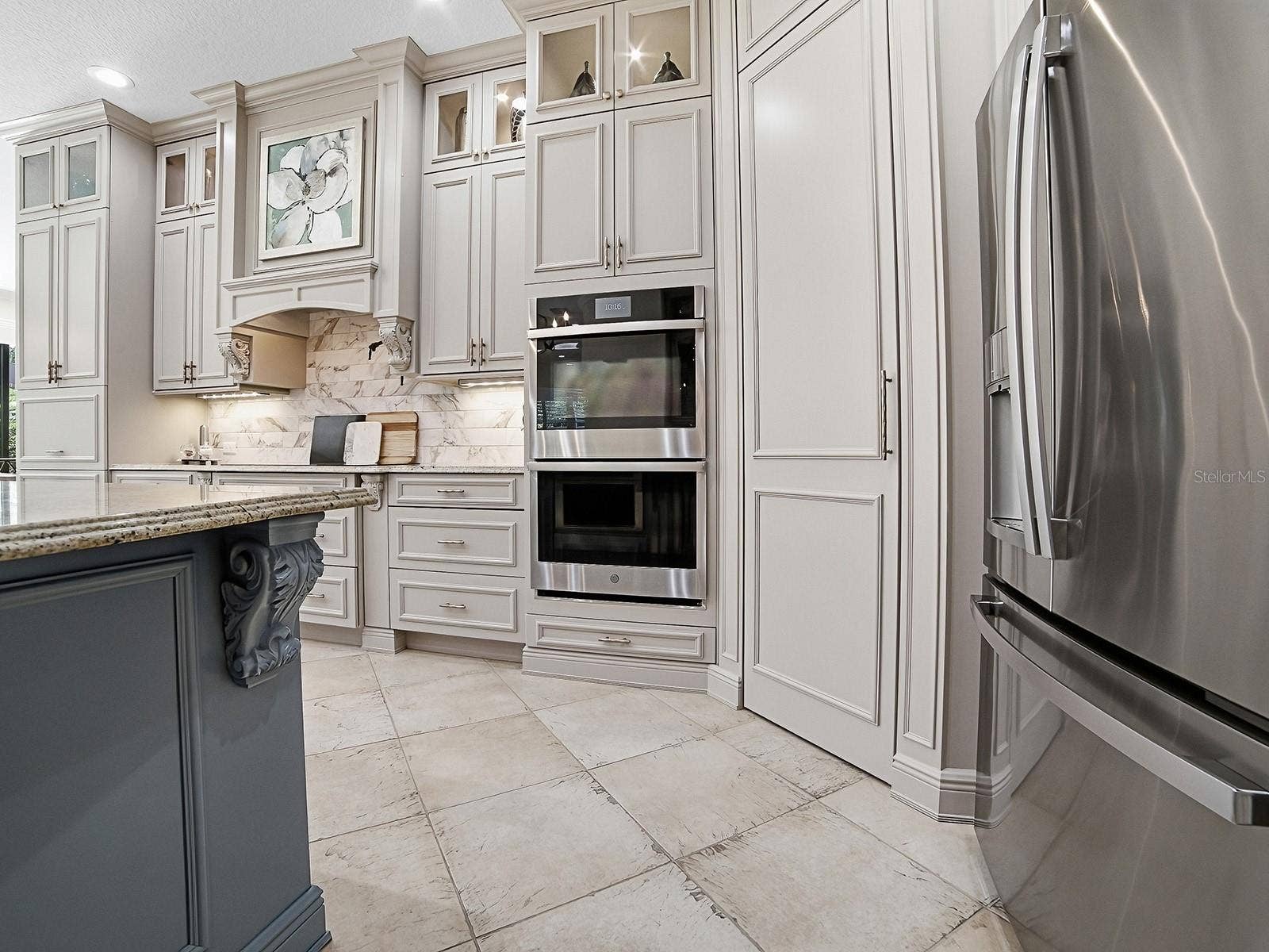 1103 MIONA SHORES DRIVE, The Villages, FL 32162 WALL OVENS AND A WALK-IN PANTRY WITH CUSTOM SHELVING AND POT FILLER!