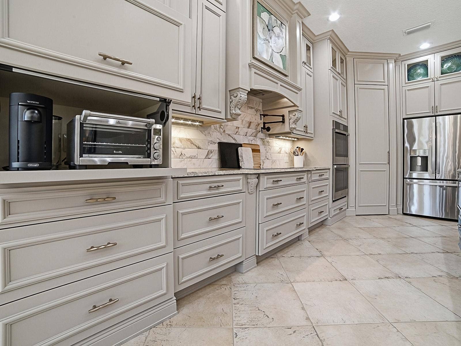 1103 MIONA SHORES DRIVE, The Villages, FL 32162 AN APPLIANCE GARAGE - GREAT FOR A COFFEE BAR, INSTANT HOT WATER, PLENTY OF COUNTER AND STORAGE SPACE!