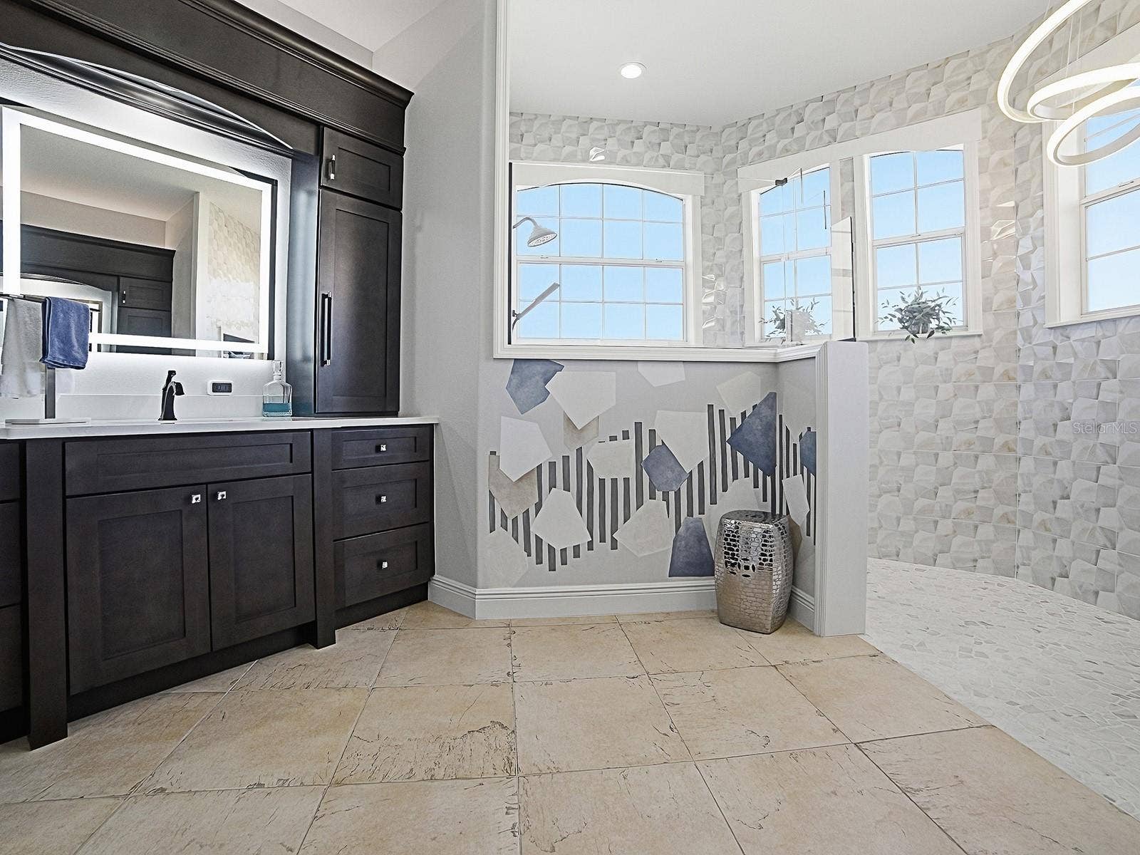 1103 MIONA SHORES DRIVE, The Villages, FL 32162 BEAUTIFUL RENOVATED BATH WITH WALK-N SHOWER WITH SHAVING MIRROR, LIGHTED MIRRORS, AND EVEN ELECTRICITY IN THE CABINETS FOR HAIRDRYERS AND SMALL APPLIANCES.