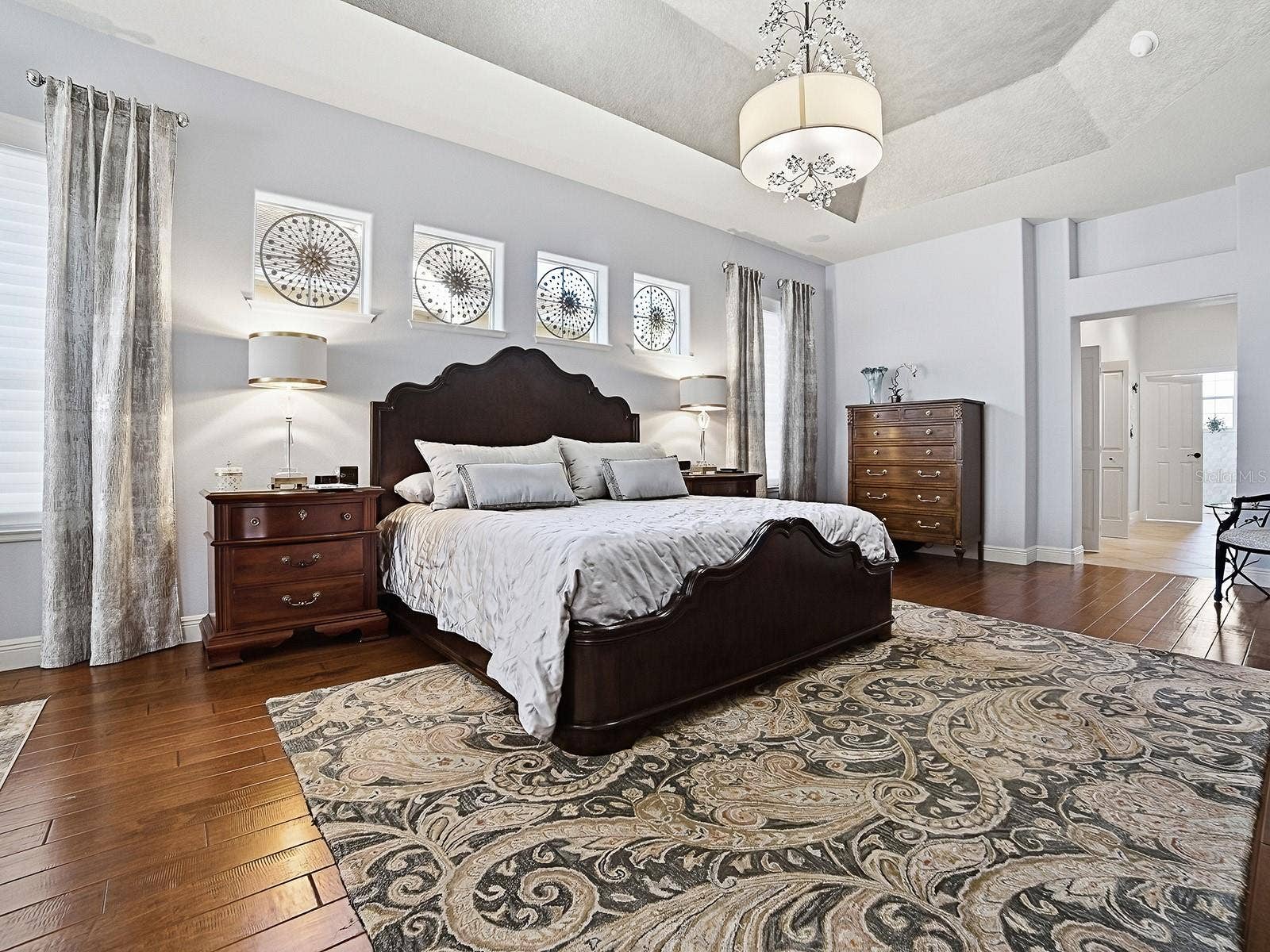 1103 MIONA SHORES DRIVE, The Villages, FL 32162 TO THE RIGHT IS THE HALLWAY LEADING TO YOUR EN-SUITE BATH WITH SPACIOUS CLOSETS AND BUILT-INS!