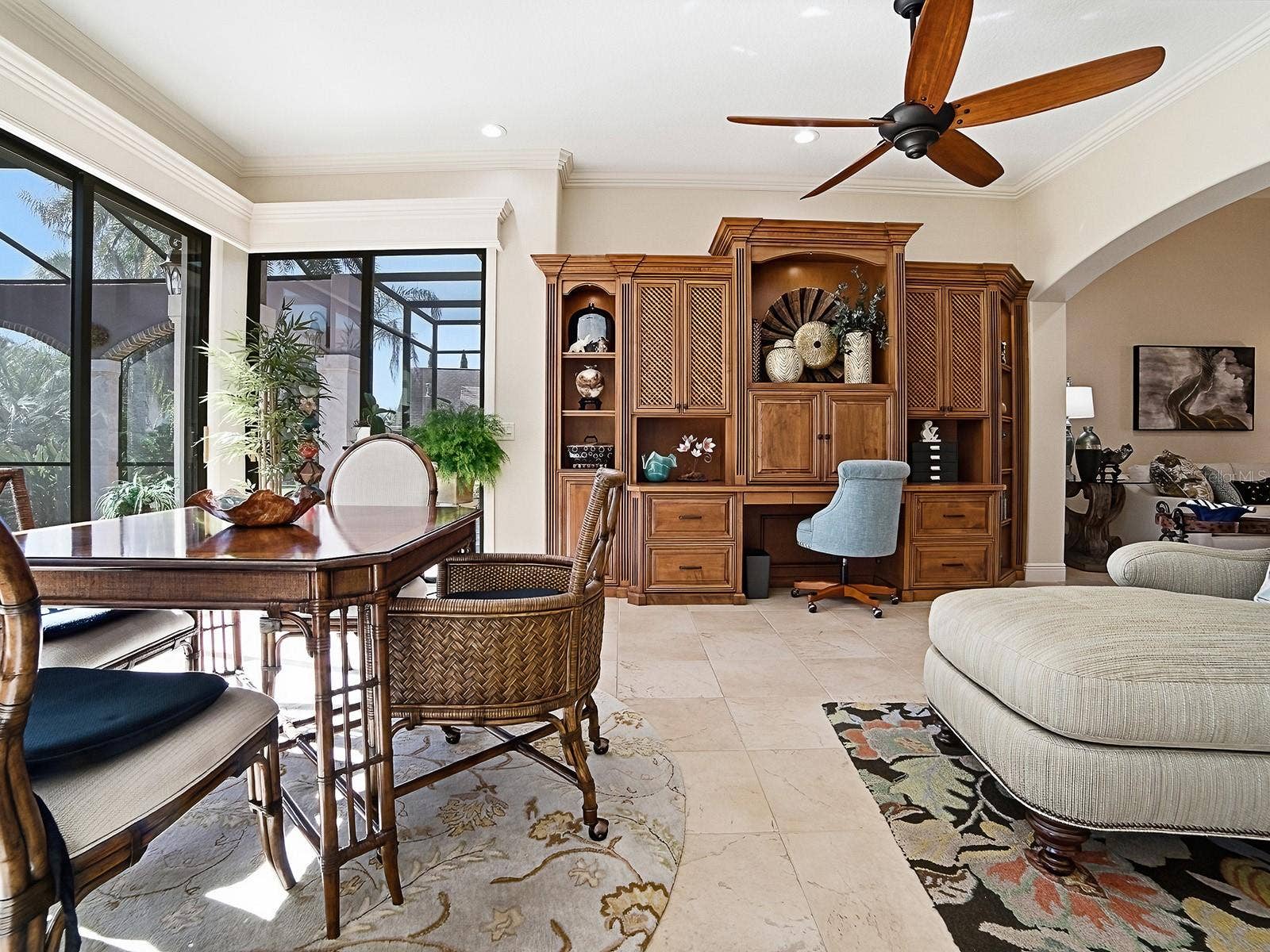 1103 MIONA SHORES DRIVE, The Villages, FL 32162 THE FAMILY ROOM FLOWS INTO THE BONUS ROOM WITH MORE SEATING FOR DINING AND/OR CARDS ANYONE? LOVELY BUILT-INS TOO!