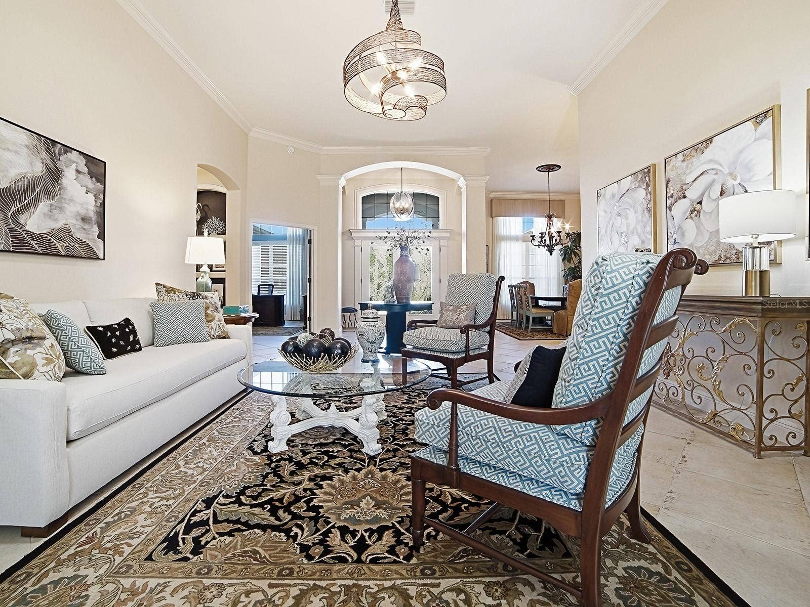 1103 MIONA SHORES DRIVE, The Villages, FL 32162 LOOKING BACK AT THE FOYER WITH THE FORMAL DINING ROOM TO THE RIGHT.