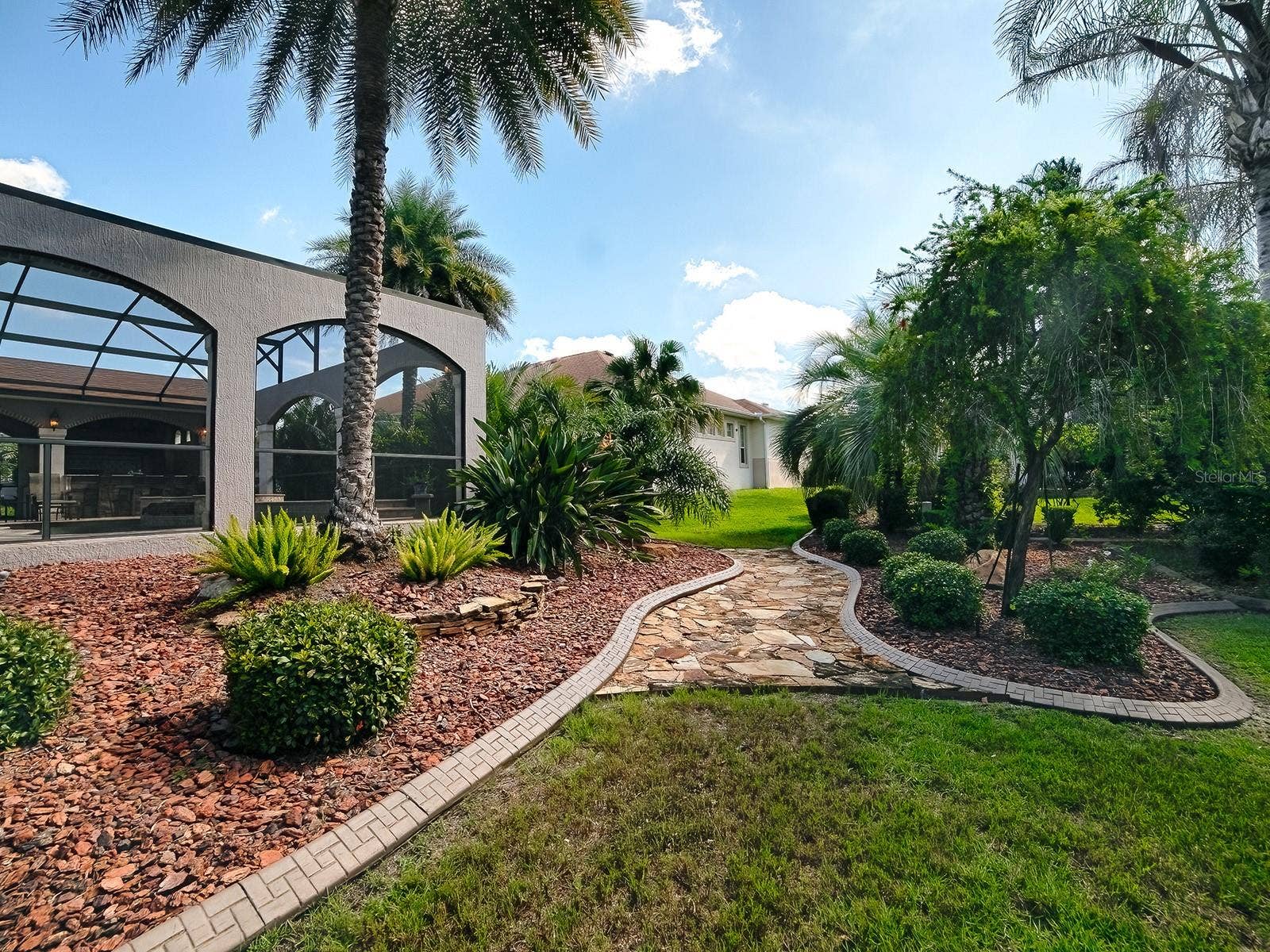 1103 MIONA SHORES DRIVE, The Villages, FL 32162 CURBING AND STONE WALKWAYS.