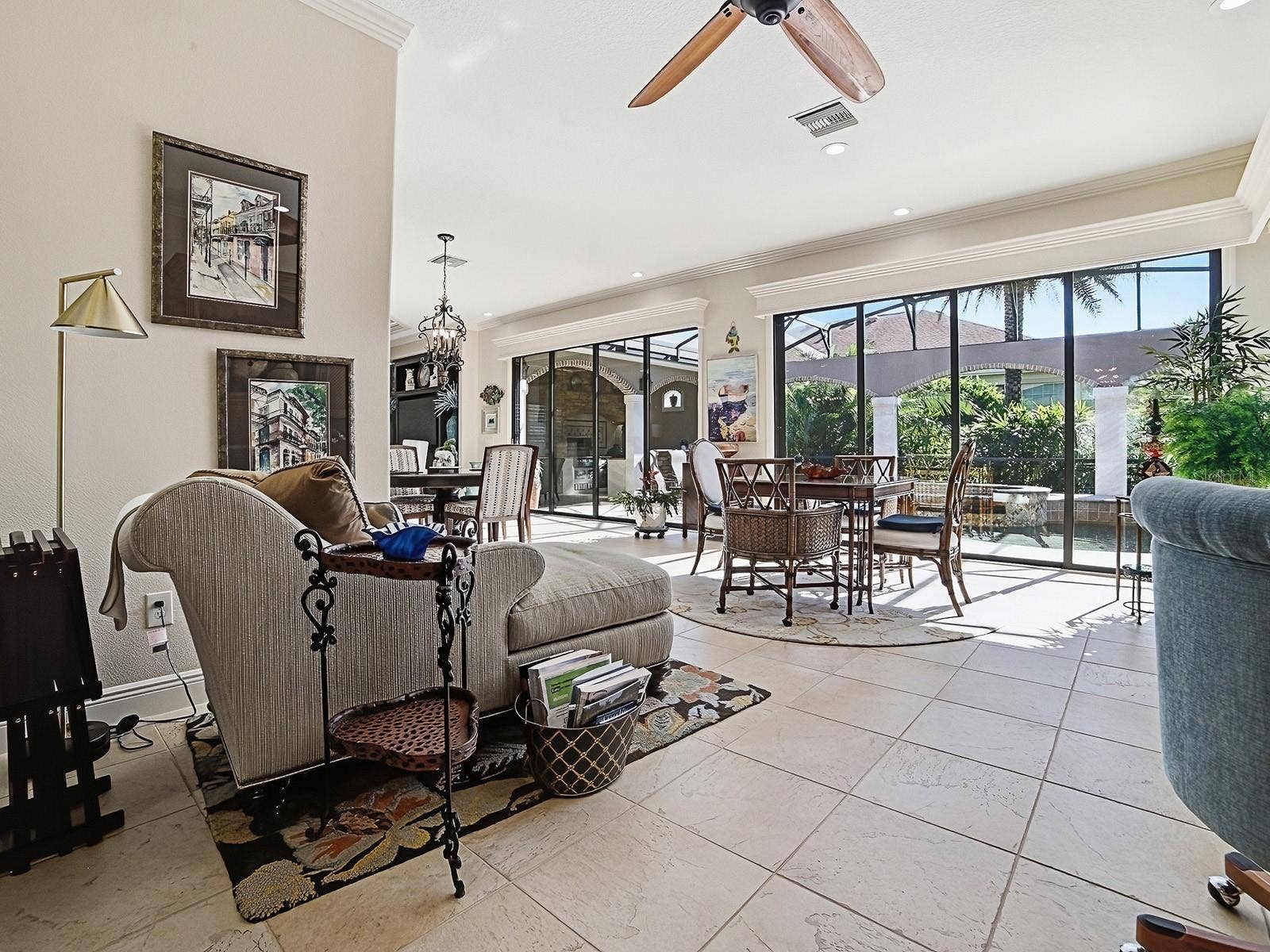 1103 MIONA SHORES DRIVE, The Villages, FL 32162 THE FAMILY ROOM AND THE BONUS AREA HAS A GREAT VIEW OF THE POOL AND LANDCAPING.