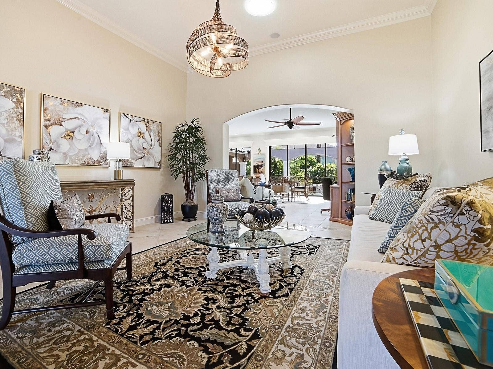 1103 MIONA SHORES DRIVE, The Villages, FL 32162 CROWN MOLDING AND BEAUTIFUL TILE THROUGHOUT THESE AREAS. YOU'LL ALSO FIND SOLAR TUBES THROUGHOUT THE HOME FOR MORE NATURAL LIGHTING.