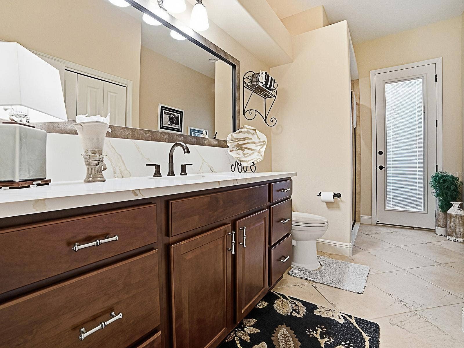 1103 MIONA SHORES DRIVE, The Villages, FL 32162 ACROSS THE HALLWAY FROM THE 3RD BEDROOM IS THE 3RD "POOL" BATH OFFERING ACCESS FROM THE INSIDE AND OUTSIDE. THERE IS A SHOWER TO THE LEFT AND LARGE LINEN CLOSET ON THE RIGHT.