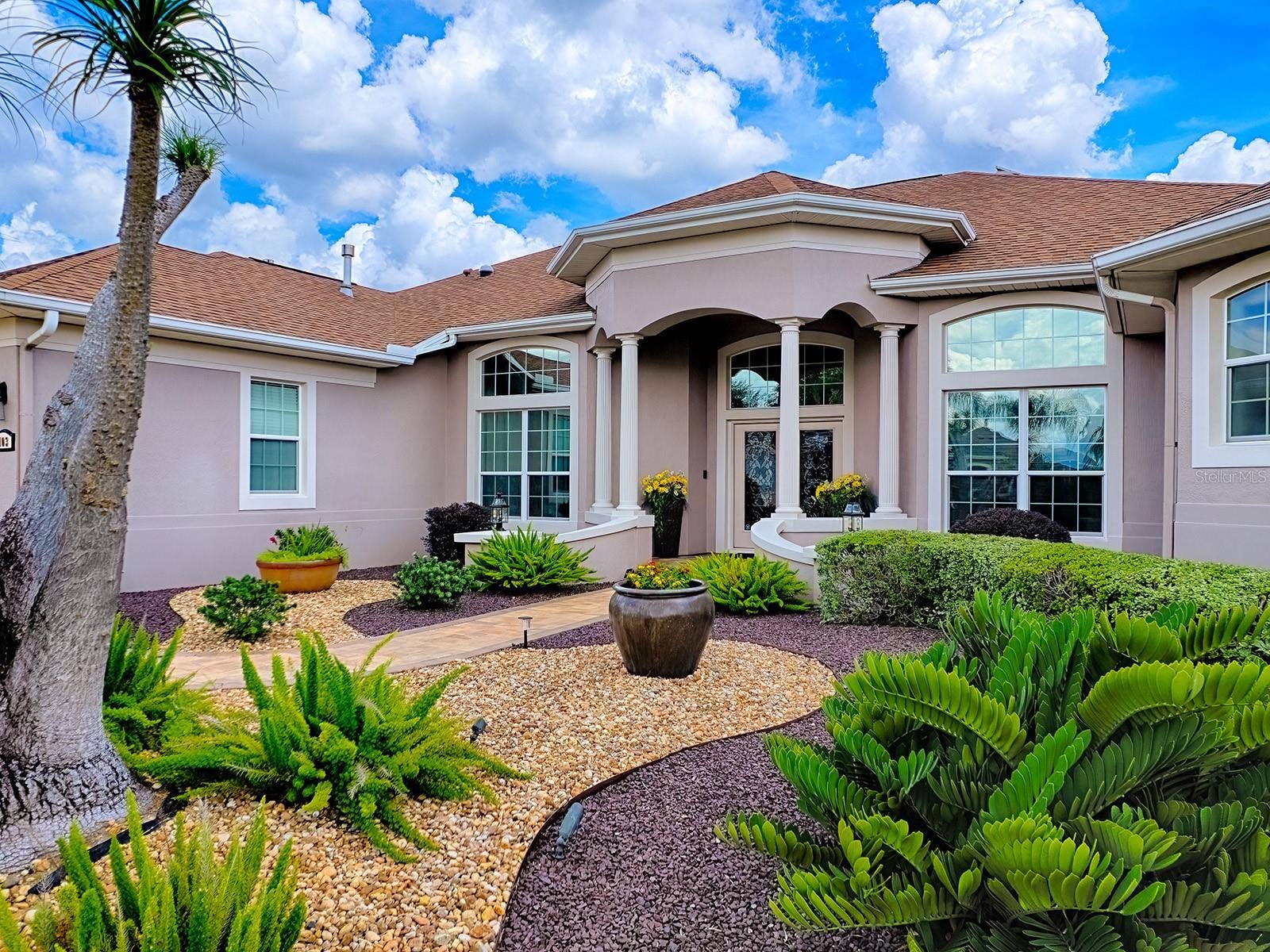 1103 MIONA SHORES DRIVE, The Villages, FL 32162 THERE IS CUSTOM LANDSCAPING AROUND THE ENTIRE HOME FOR EASY MAINTENANCE AND LOVELY CURB APPEAL.