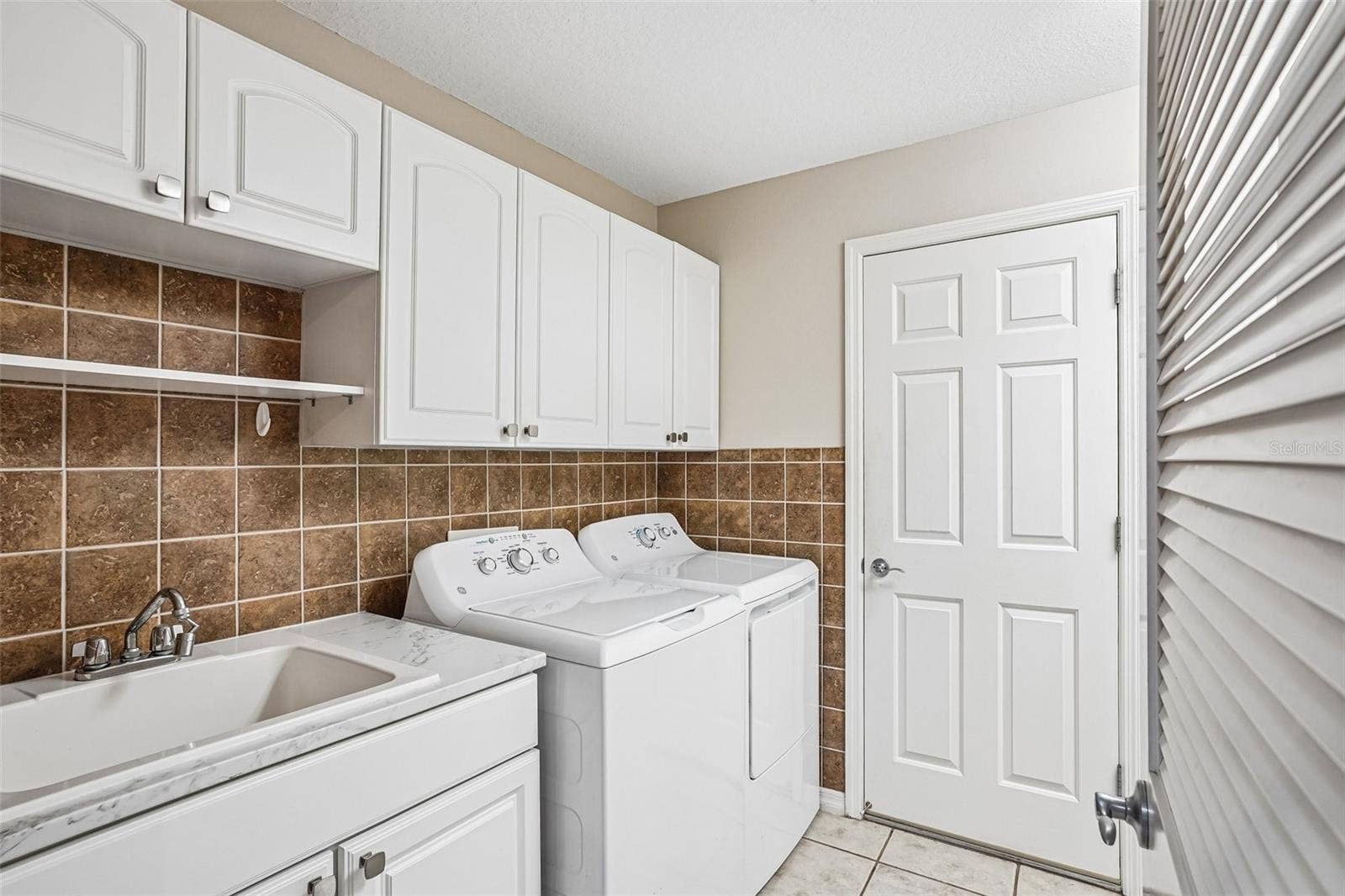17115 SE 93RD TELLFIER TERRACE, The Villages, FL 32162 big laundry room