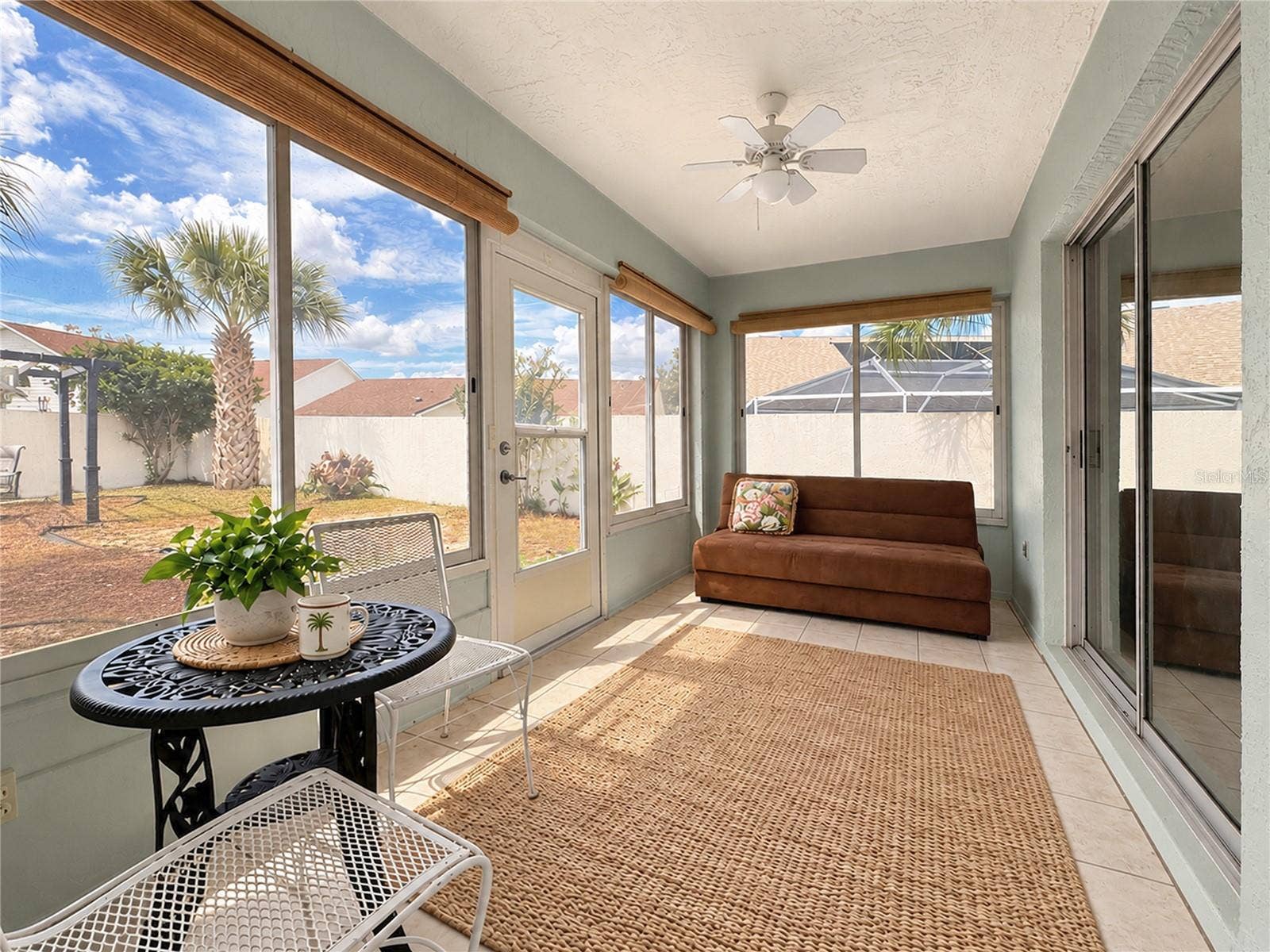 1318 BALBOA COURT, The Villages, FL 32159 Lanai with sliding windows (floor rug is different)