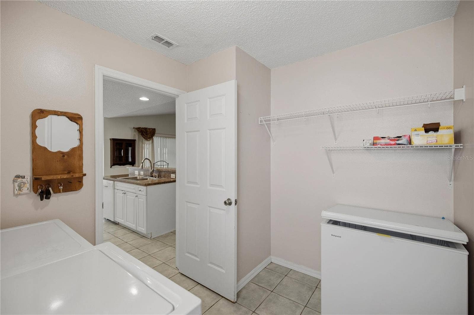 32802 CROOKED OAKS LANE, Leesburg, FL 34748 Inside Laundry Room