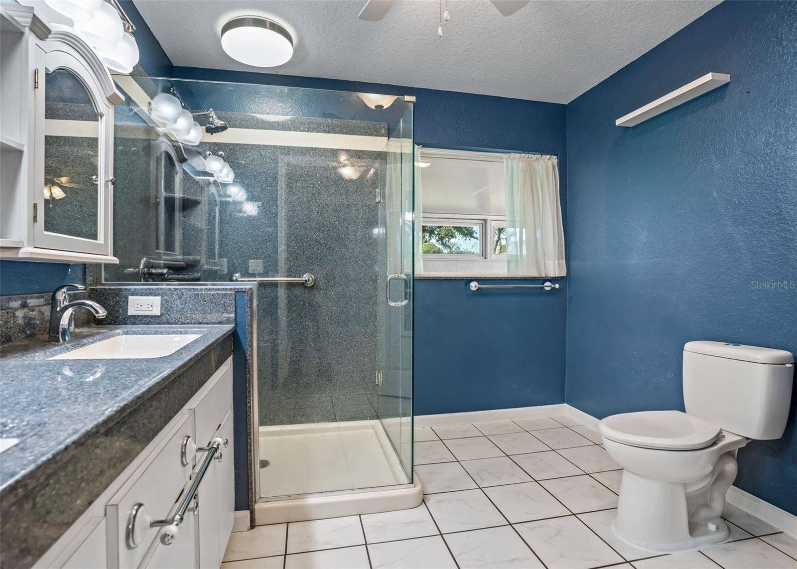 Large Tiled Walk In Shower & High Rise Commode