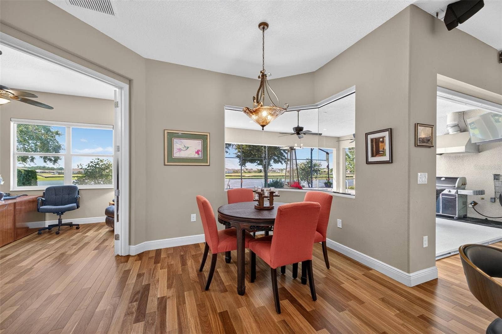 2444 PAWTUCKET PASS, Mount Dora, FL 32757 Conveniently situated just off the breakfast room, the private home office boasts tranquil lake views for an inspiring workspace.