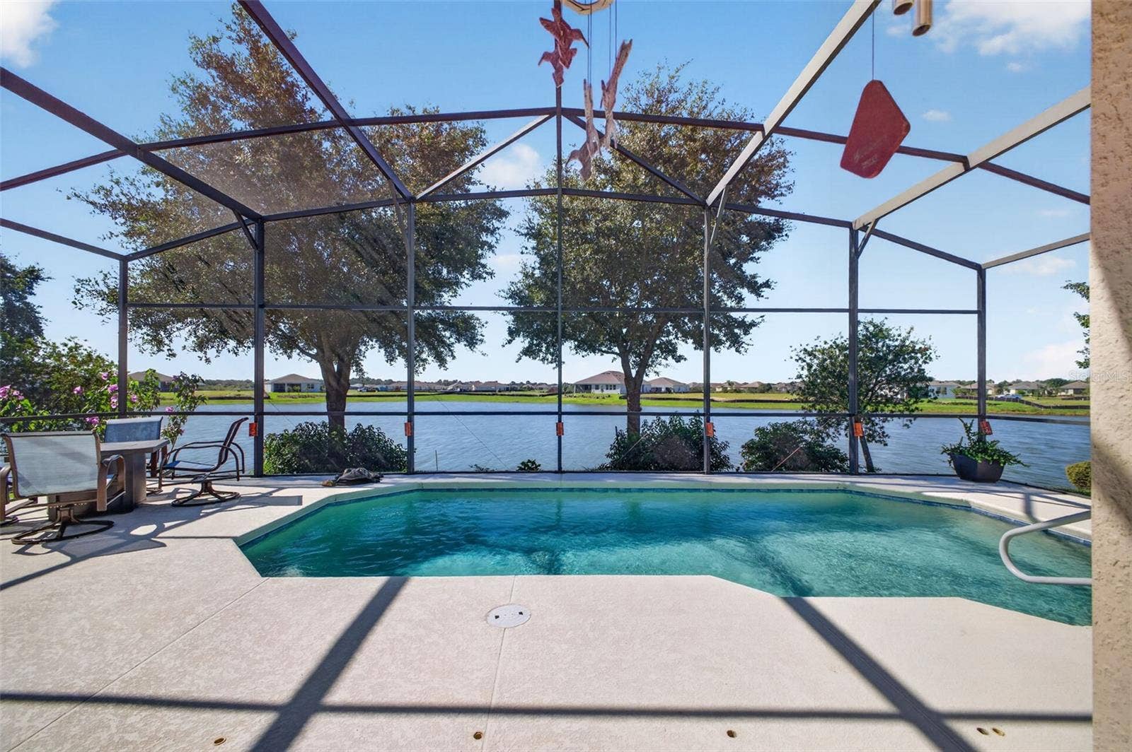 2444 PAWTUCKET PASS, Mount Dora, FL 32757 Take a refreshing dip in the pool while taking in the vibrant waterfront activity on the lake.