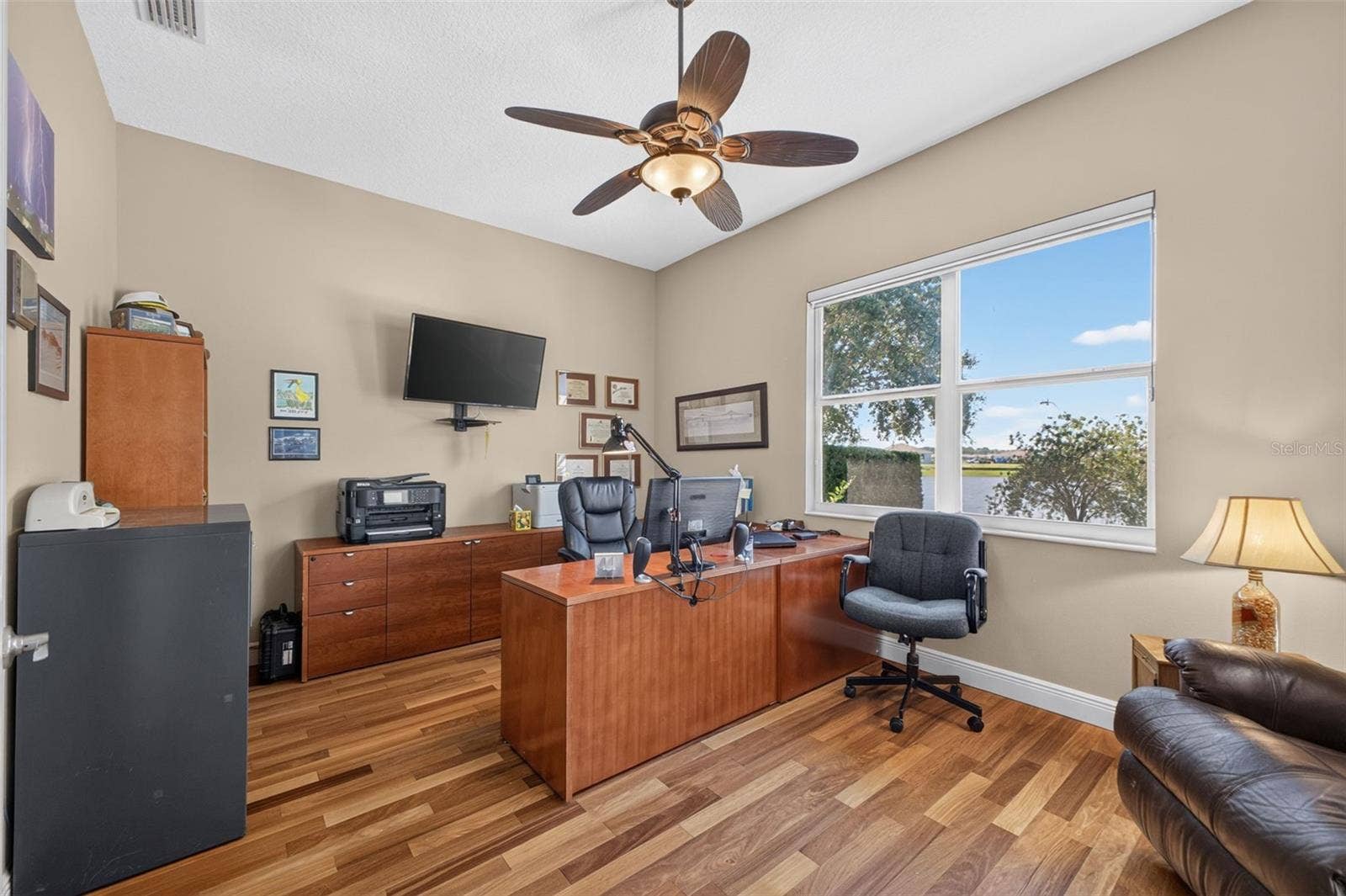 2444 PAWTUCKET PASS, Mount Dora, FL 32757 The expansive office offers exceptional flexibility, perfectly suited as a private work-from-home sanctuary, den, or library.