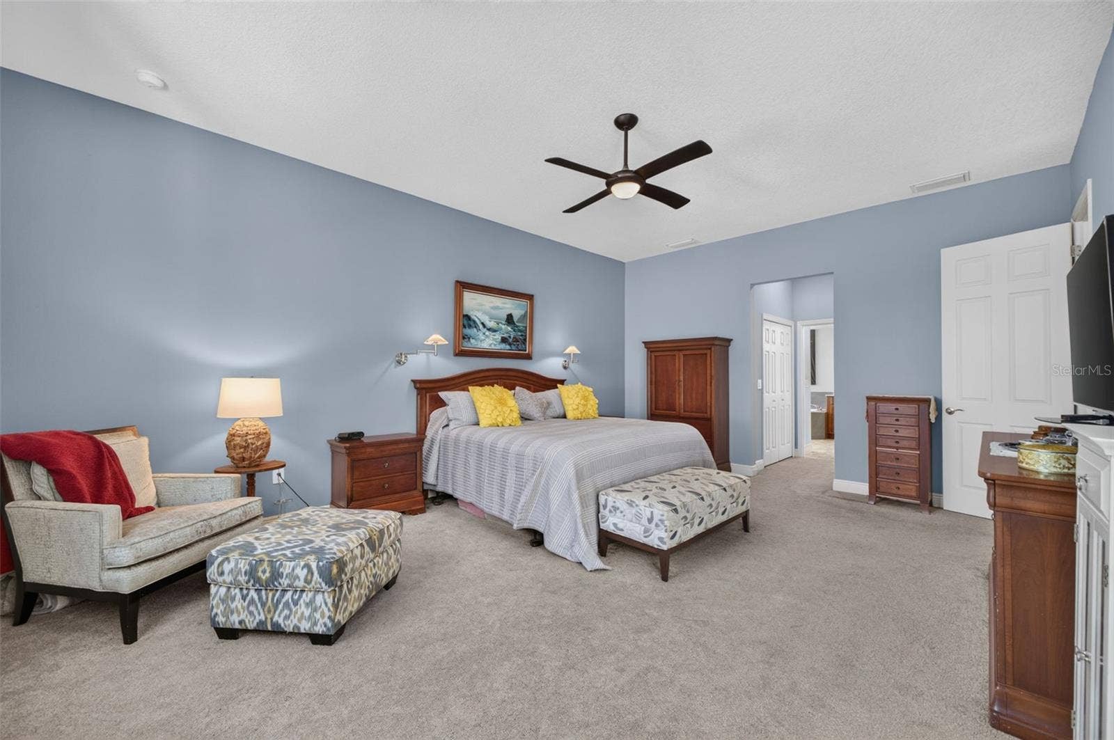 2444 PAWTUCKET PASS, Mount Dora, FL 32757 A serene sanctuary, this sunlit primary retreat offers expansive dual walk-in closets and an exquisite, spa-inspired en-suite bathroom.