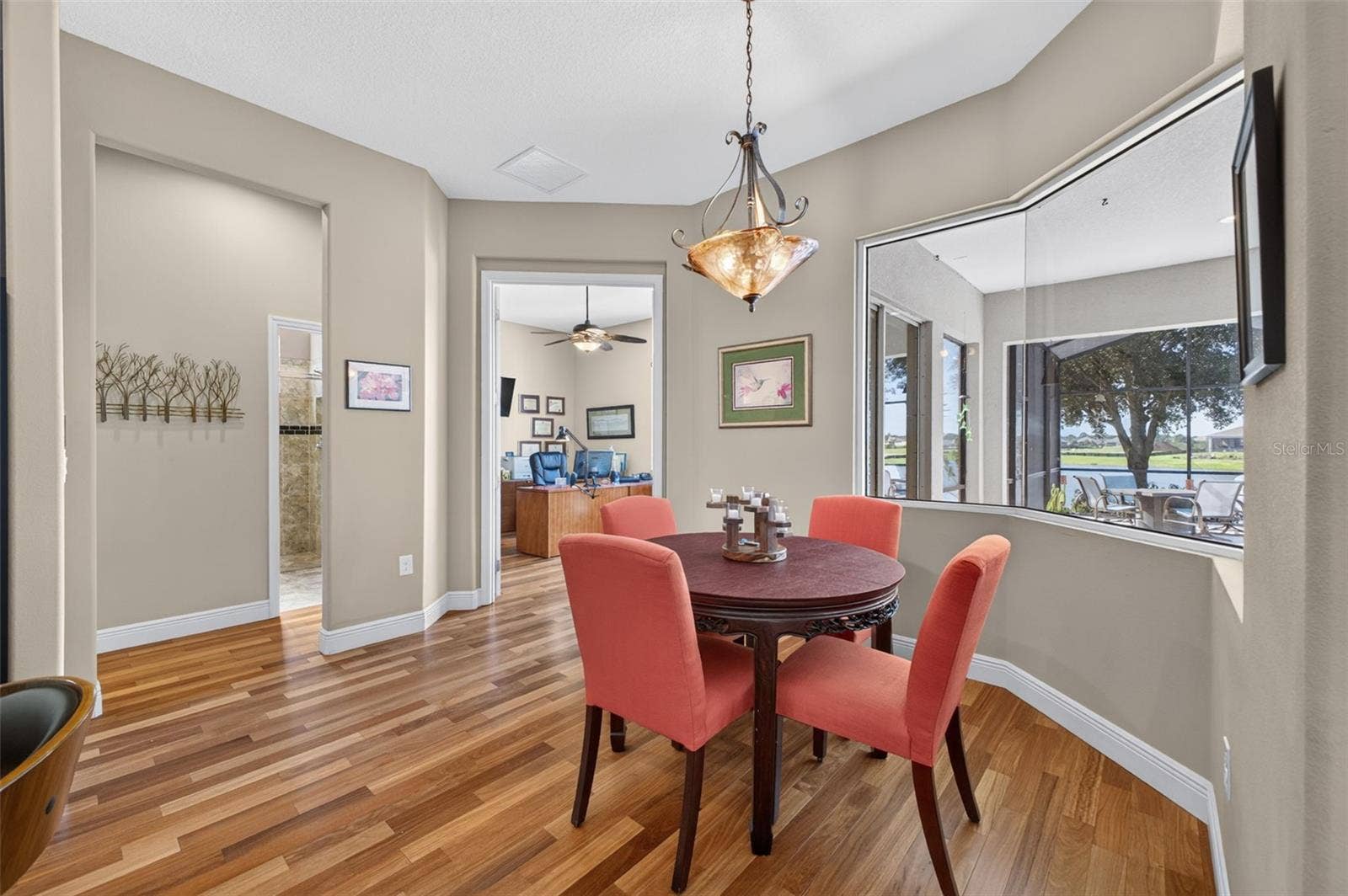 2444 PAWTUCKET PASS, Mount Dora, FL 32757 The cozy breakfast room offers a charming nook to enjoy morning coffee accompanied by serene lake views.