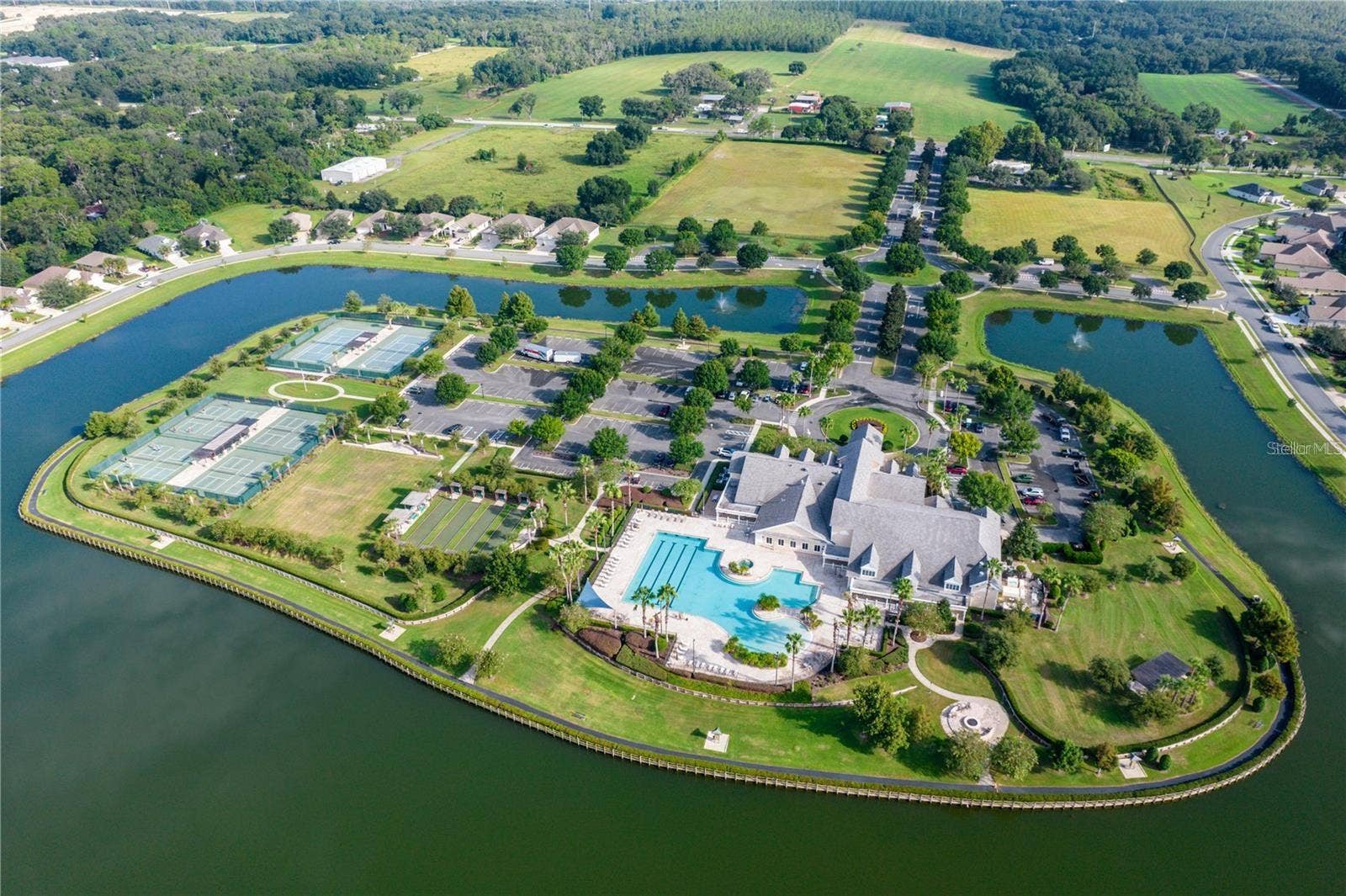 2444 PAWTUCKET PASS, Mount Dora, FL 32757 The communitys Activity Peninsula features an array of outdoor recreation amenities surrounded by scenic lake views.
