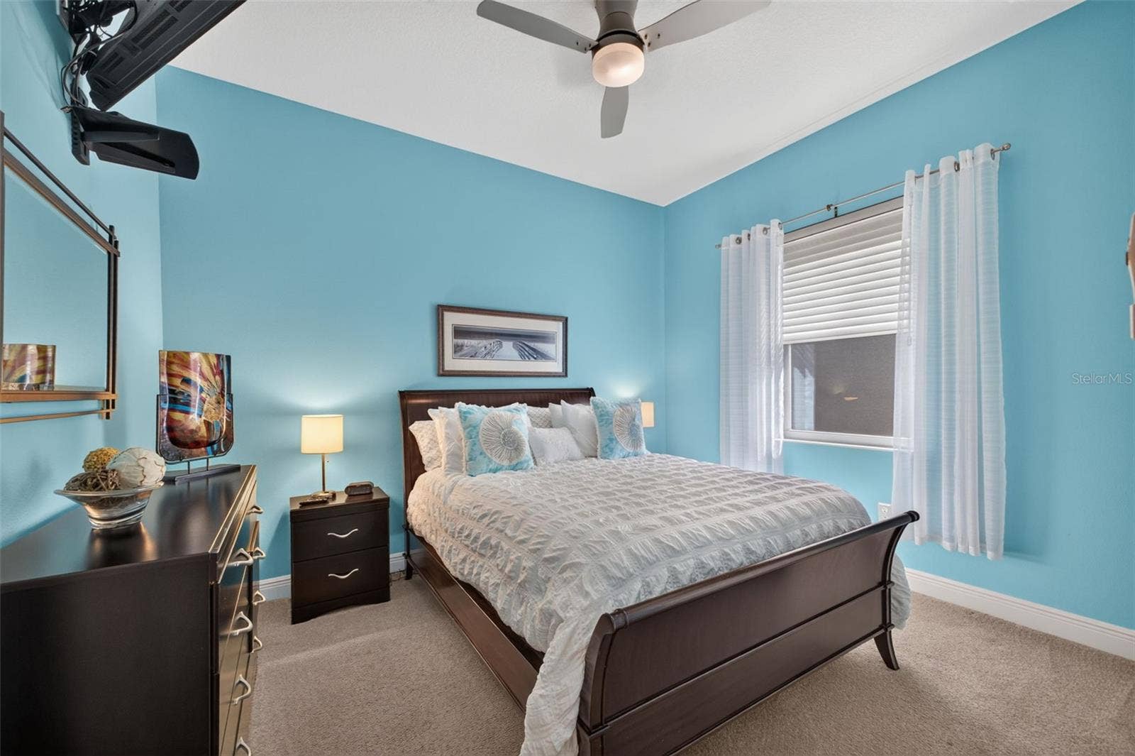 2444 PAWTUCKET PASS, Mount Dora, FL 32757 A bright and welcoming retreat, this third bedroom offers generous proportions to comfortably accommodate overnight guests in style.