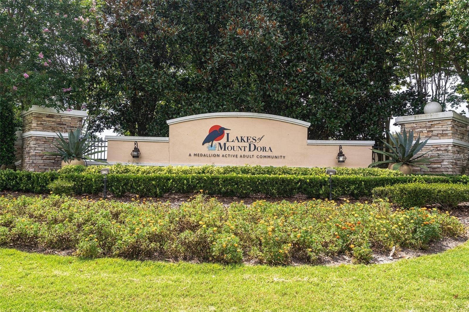 2444 PAWTUCKET PASS, Mount Dora, FL 32757 The elegant entrance sign marks the gateway to the highly sought-after Lakes of Mount Dora lifestyle.