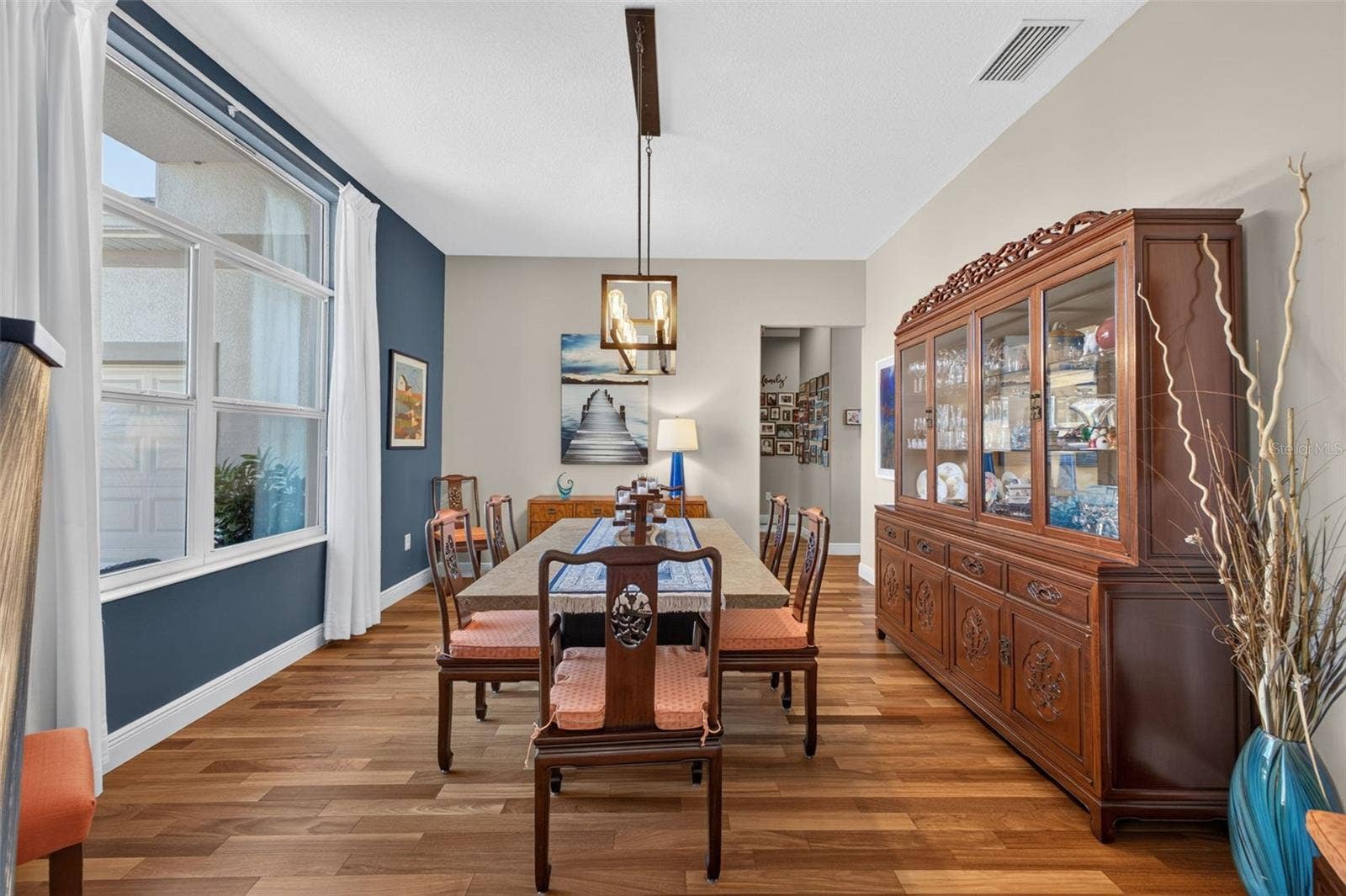 2444 PAWTUCKET PASS, Mount Dora, FL 32757 Positioned at the front of the home, this elegant formal dining area greets guests with style and charm.