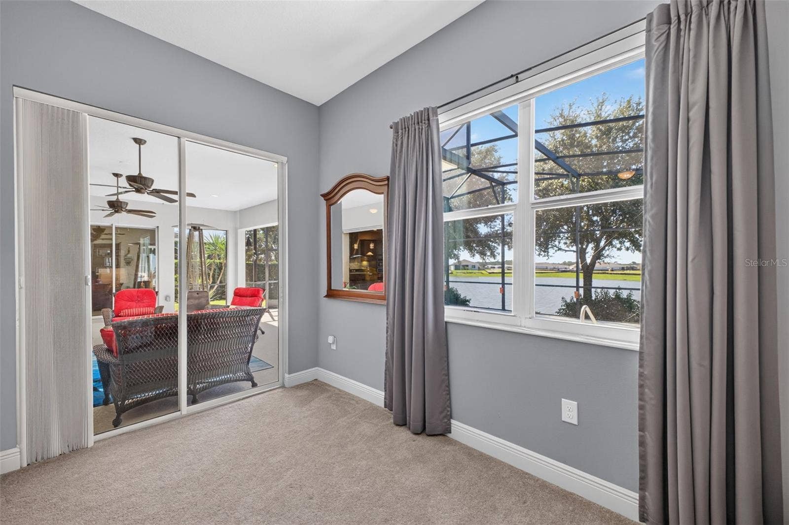 2444 PAWTUCKET PASS, Mount Dora, FL 32757 Step straight from your private primary sanctuary onto the sunlit lanai and pool deck via large sliding glass doors.