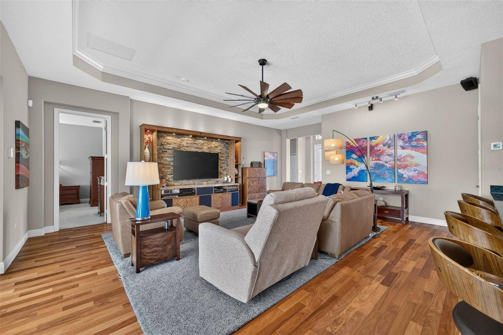 2444 PAWTUCKET PASS, Mount Dora, FL 32757 Stunning Brazilian Teak engineered hardwood flooring adds incredible depth and elegance to the spacious great room.