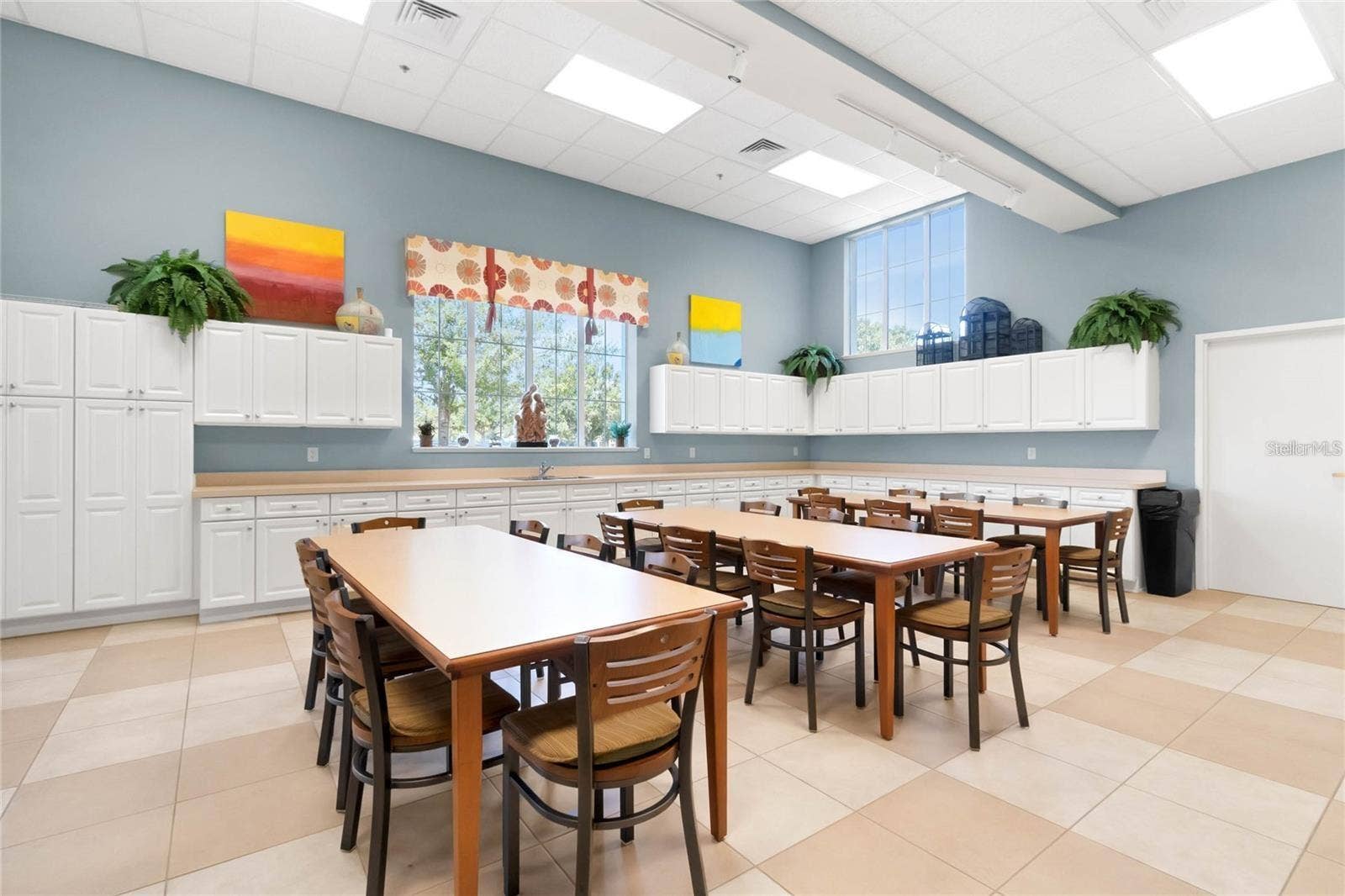 2444 PAWTUCKET PASS, Mount Dora, FL 32757 A dedicated community craft room provides a spacious, well-lit studio for artistic projects, crafting, and creative workshops.
