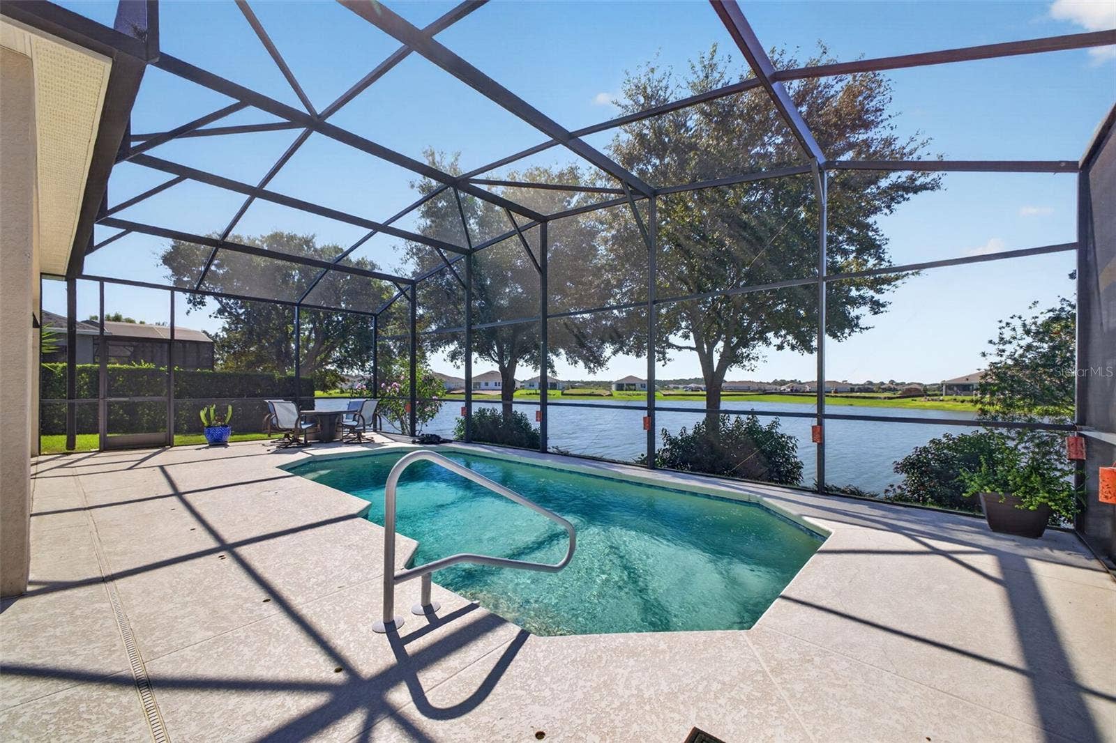2444 PAWTUCKET PASS, Mount Dora, FL 32757 Expanded for maximum outdoor enjoyment, the generous lanai and patio create a seamless backyard oasis built for effortless relaxation and entertaining.