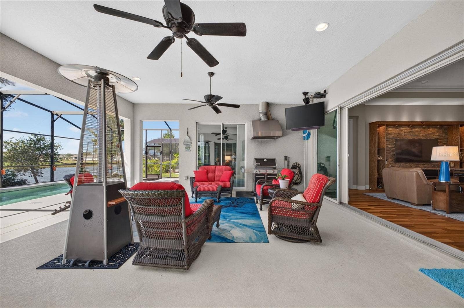 2444 PAWTUCKET PASS, Mount Dora, FL 32757 Experience quintessential indoor-outdoor living as pocket glass sliders open wide to merge the interior living space effortlessly with the covered lanai.
