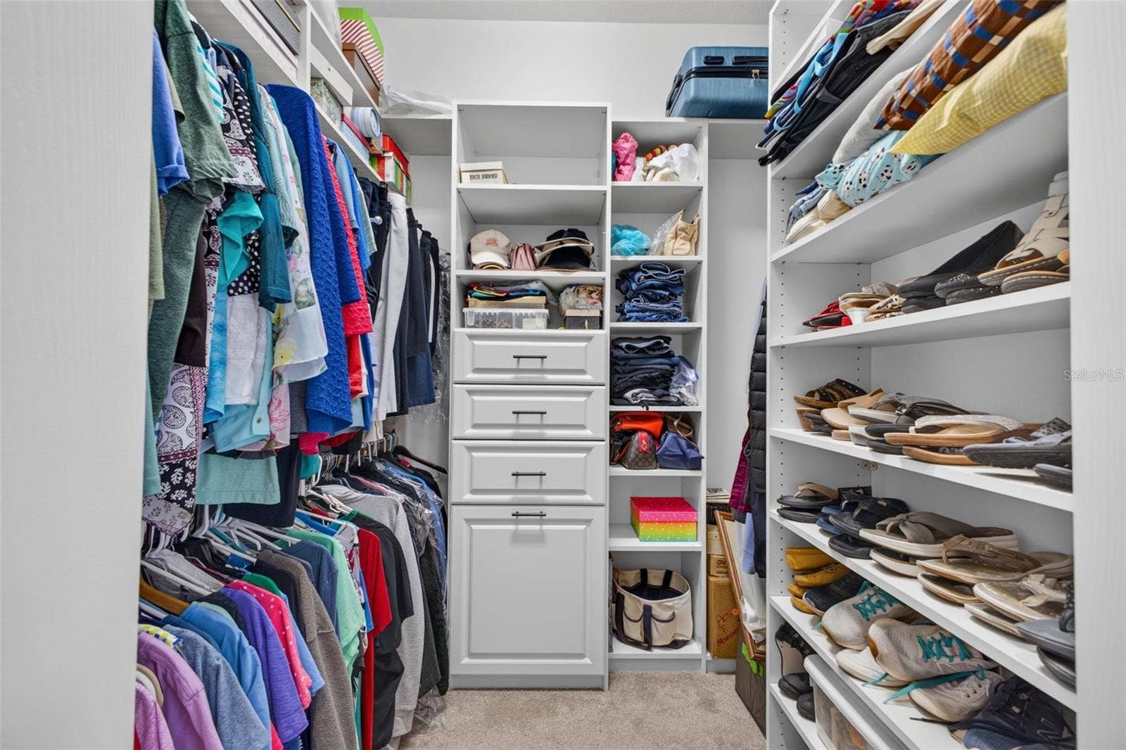 2444 PAWTUCKET PASS, Mount Dora, FL 32757 The primary suite features generous dual walk-in closets, providing ample room for extensive wardrobes and personal storage.