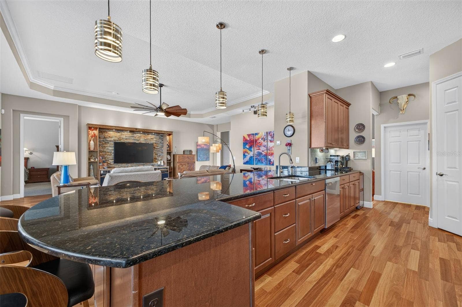 2444 PAWTUCKET PASS, Mount Dora, FL 32757 An expansive kitchen peninsula provides generous prep space, perfect for baking, meal prep, or entertaining.