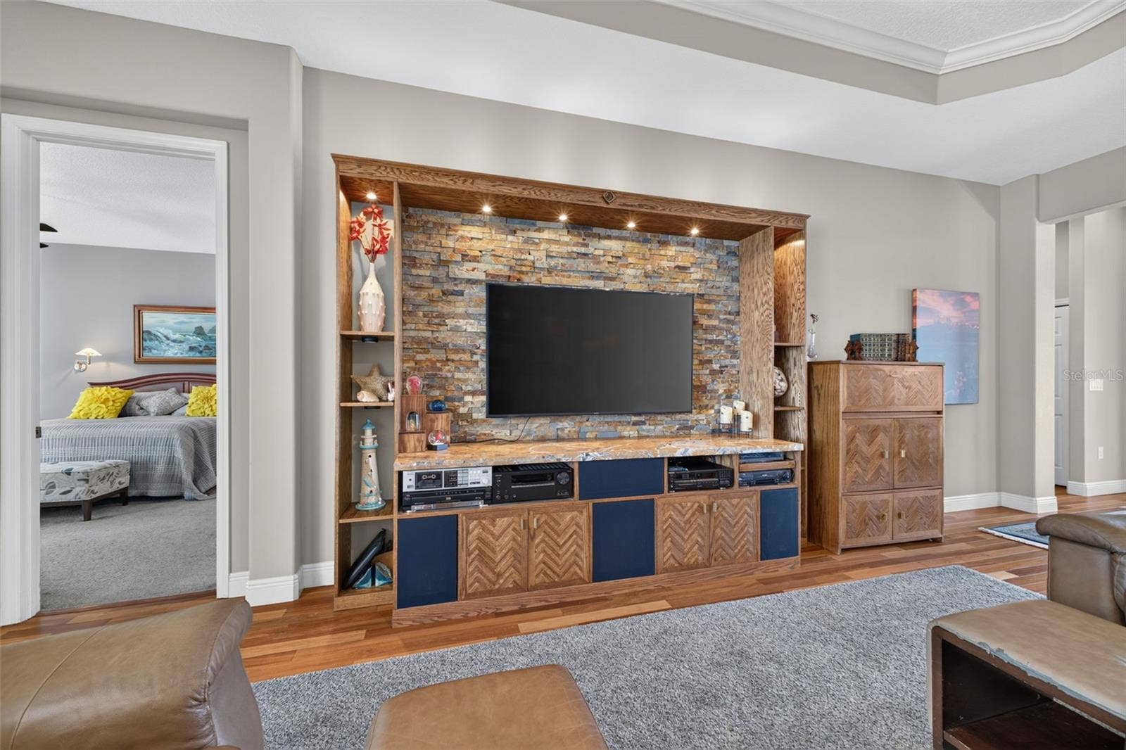 2444 PAWTUCKET PASS, Mount Dora, FL 32757 Positioned off the great room for optimal privacy, the main-level primary suite enjoys direct access to the lanai and pool.