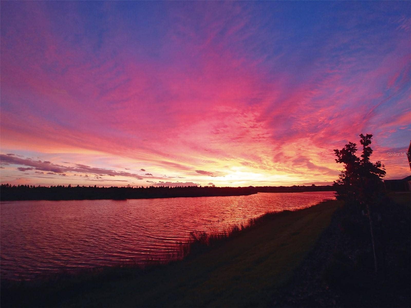 2444 PAWTUCKET PASS, Mount Dora, FL 32757 Unwind at dusk and watch stunning sunsets unfold right from the comfort of the lanai and pool.(owner photo)