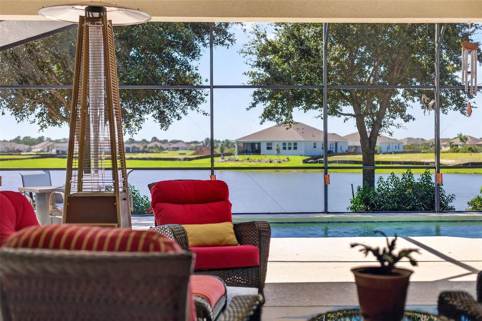 2444 PAWTUCKET PASS, Mount Dora, FL 32757 Take in breathtaking pool and lake views from your expansive, covered lanaithe ultimate setting for outdoor living and entertaining.